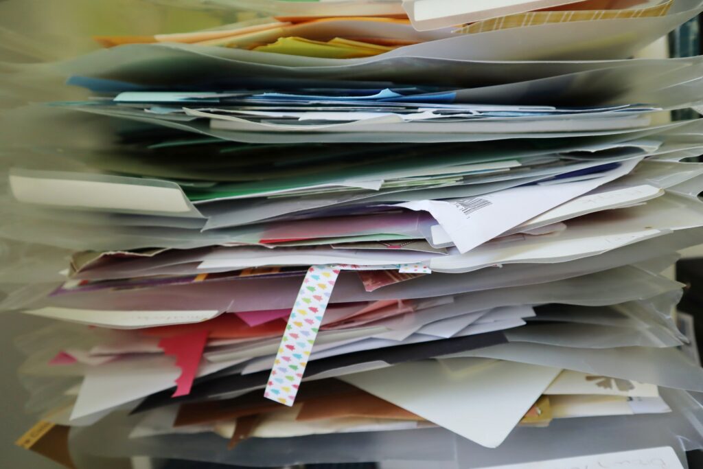 Plastic sleeves full of paper and cardstock scraps